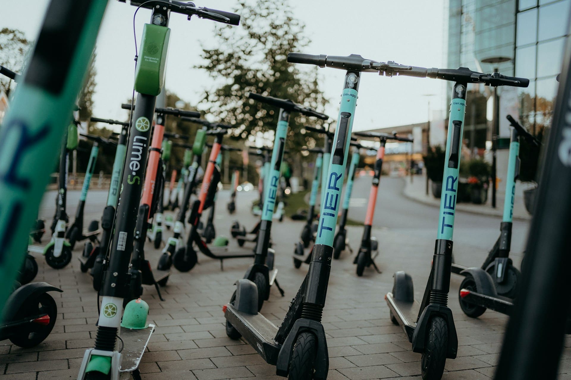 Self-service electric scooters parked around town